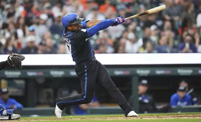 Detroit Tigers' Andy Ibáñez hits a home run against the Kansas City Royals in the fourth inning during a baseball game, Friday, April 18, 2025, in Detroit. (AP Photo/Paul Sancya)