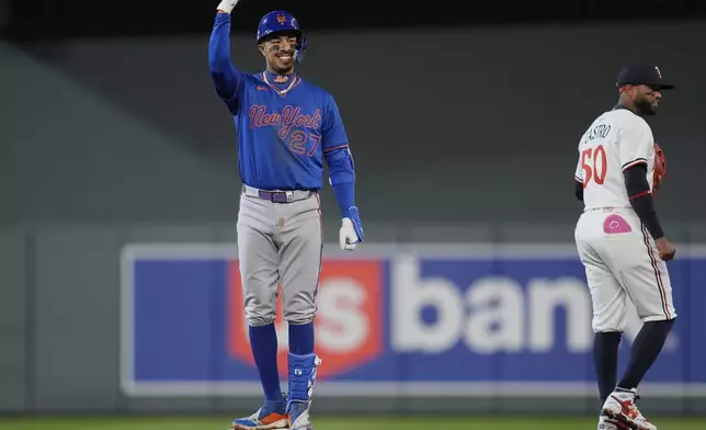 New York Mets' Mark Vientos (27) gestures after hitting an RBI double during the sixth inning of a baseball game against the Minnesota Twins, Monday, April 14, 2025, in Minneapolis. (AP Photo/Abbie Parr)
