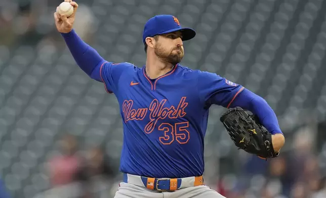 New York Mets starting pitcher Clay Holmes (35) delivers during the first inning of a baseball game against the Minnesota Twins, Monday, April 14, 2025, in Minneapolis. (AP Photo/Abbie Parr)