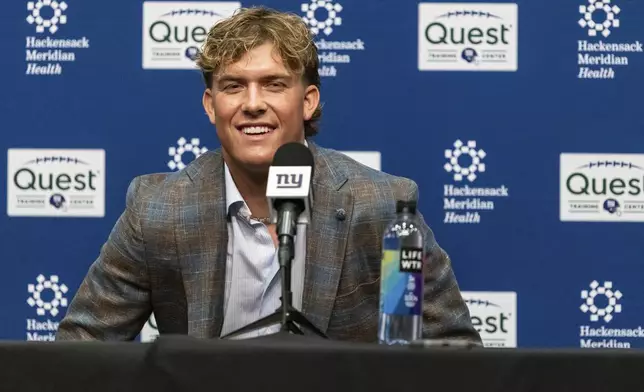 New York Giants first-round draft pick Jaxson Dart speaks to reporters at a news conference at the NFL football team's training center in East Rutherford, N.J., Friday, April 25, 2025. (AP Photo/Stefan Jeremiah)
