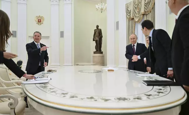 Russian President Vladimir Putin, third right, and U.S. President Donald Trump's special envoy Steve Witkoff, left, arrive to attend their talks at the Kremlin in Moscow, Russia, Friday, April 25, 2025. (Kristina Kormilitsyna, Sputnik, Kremlin Pool Photo via AP)