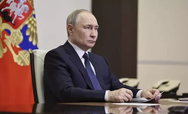 Russian President Vladimir Putin listens to Russian Chief of General Staff Gen. Valery Gerasimov with the report that all Ukrainian troops have been forced from Russia's Kursk region, during their meeting via videoconference at the Novo-Ogaryovo residence outside Moscow, Russia, Saturday, April 26, 2025. (Alexander Kazakov, Sputnik, Kremlin Pool Photo via AP)