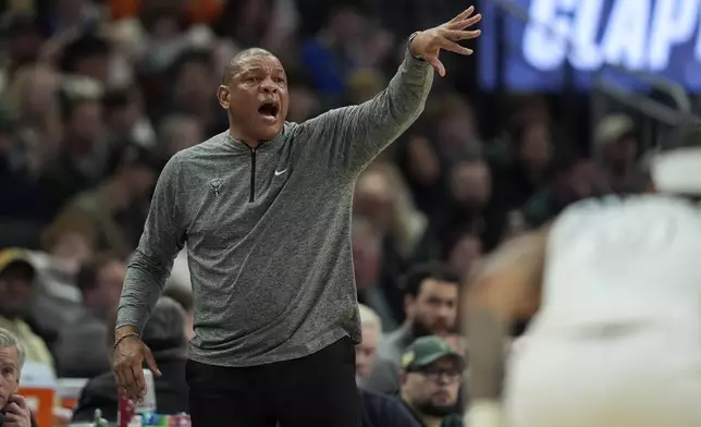 Milwaukee Bucks head coach Doc Rivers gestures from the sidelines during the first half of an NBA basketball game against the Minnesota Timberwolves, Tuesday, April 8, 2025, in Milwaukee. (AP Photo/Aaron Gash)