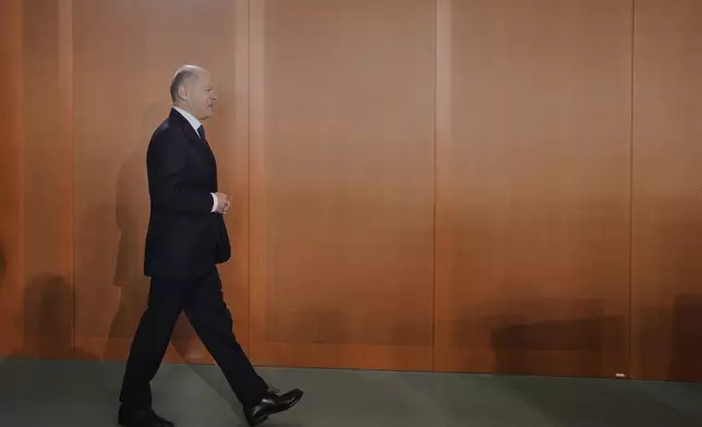 Outgoing Chancellor Olaf Scholz arrives at the last expected cabinet meeting of his government at the chancellery in Berlin, Germany, Wednesday, April 30, 2025. (AP Photo/Markus Schreiber)