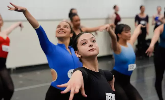 Dancers rehearse choreography before an audition for the Radio City Rockettes at Radio City Music Hall, Tuesday, April 22, 2025, in New York. (AP Photo/Julia Demaree Nikhinson)