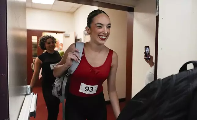 A dancer enters a rehearsal hall before an audition for the Radio City Rockettes at Radio City Music Hall, Tuesday, April 22, 2025, in New York. (AP Photo/Julia Demaree Nikhinson)