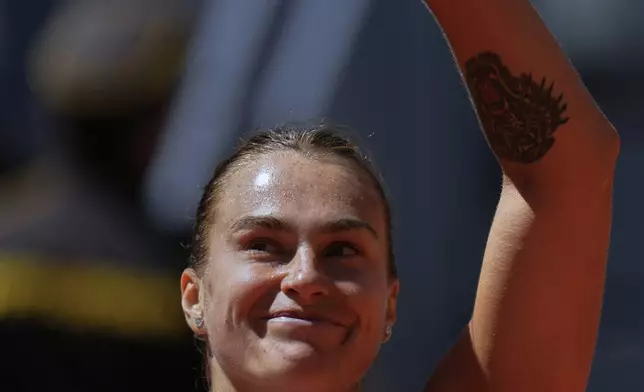 Aryna Sabalenka of Belarus celebrates after her victory over Elise Mertens of Belgium during the Madrid Open tennis tournament in Madrid, Spain, Sunday, April 27, 2025. (AP Photo/Manu Fernandez)
