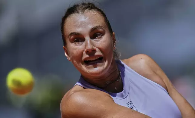 Aryna Sabalenka of Belarus eyes the ball as she plays a shot against Elise Mertens of Belgium during the Madrid Open tennis tournament in Madrid, Spain, Sunday, April 27, 2025. (AP Photo/Manu Fernandez)