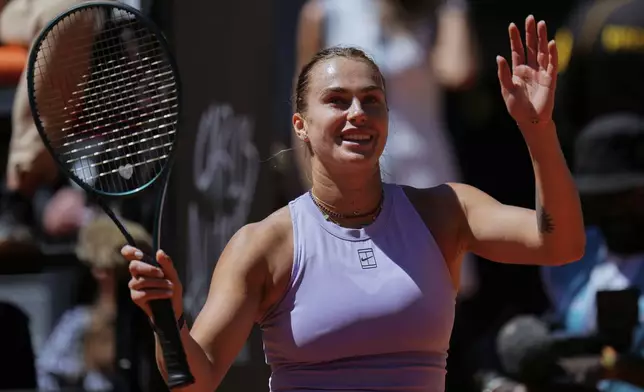 Aryna Sabalenka of Belarus celebrates after her victory over Elise Mertens of Belgium during the Madrid Open tennis tournament in Madrid, Spain, Sunday, April 27, 2025. (AP Photo/Manu Fernandez)
