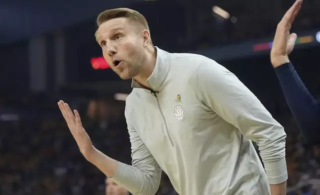 Memphis Grizzlies interim head coach Tuomas Iisalo gestures toward officials during the first half of an NBA play-in tournament basketball game against the Golden State Warriors in San Francisco, Tuesday, April 15, 2025. (AP Photo/Jeff Chiu)