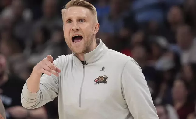 Memphis Grizzlies interim head coach Tuomas Iisalo yells during the second half of an NBA play-in tournament basketball game against the Dallas Mavericks, Friday, April 18, 2025, in Memphis, Tenn. (AP Photo/George Walker IV)