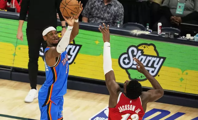 Oklahoma City Thunder guard Shai Gilgeous-Alexander (2) shoots the ball over Memphis Grizzlies forward Jaren Jackson Jr. (13) during the second half in Game 4 of an NBA basketball first-round playoff series Saturday, April 26, 2025, in Memphis, Tenn. (AP Photo/George Walker IV)