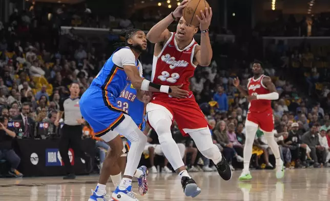 Memphis Grizzlies guard Desmond Bane (22) runs to the basket past Oklahoma City Thunder guard Isaiah Joe (11) during the first half in Game 4 of an NBA basketball first-round playoff series Saturday, April 26, 2025, in Memphis, Tenn. (AP Photo/George Walker IV)