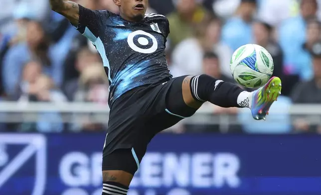 Minnesota United midfielder Joseph Rosales (8) controls the ball against the Vancouver Whitecaps during the second half of an MLS soccer match on Sunday, April 27, 2025, in St. Paul, Minn. (AP Photo/Adam Bettcher)