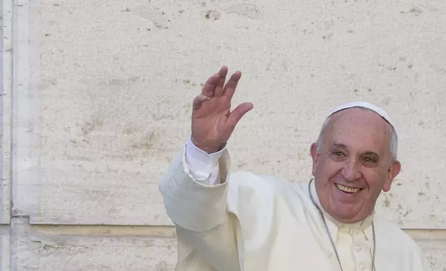 FILE - Pope Francis waves to members of the media as he leaves a synod on family issues at the Vatican, Oct. 10, 2014. (AP Photo/Alessandra Tarantino, File)