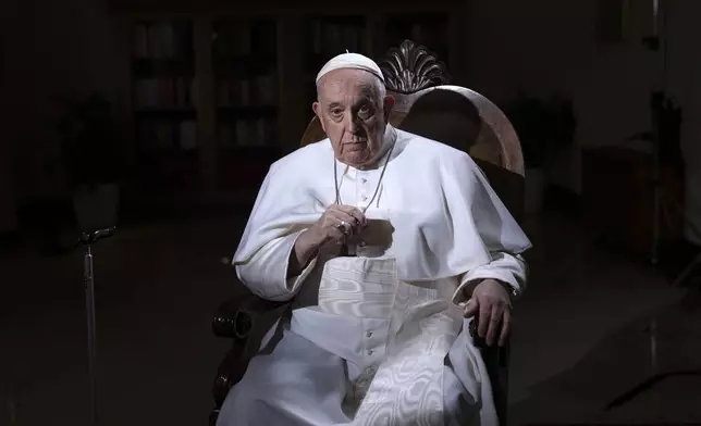 FILE - Pope Francis pauses during an interview with The Associated Press at The Vatican, Jan. 24, 2023. (AP Photo/Domenico Stinellis, File)