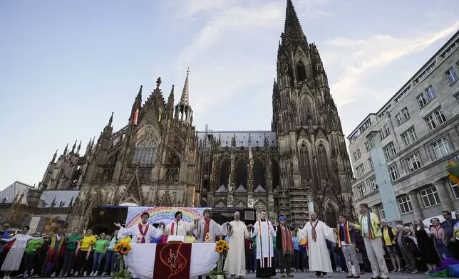 FILE - A public blessing ceremony with hundreds of believers takes place in front of the Cologne Cathedral in Cologne, Germany, Sept. 20, 2023. (AP Photo/Martin Meissner, File)