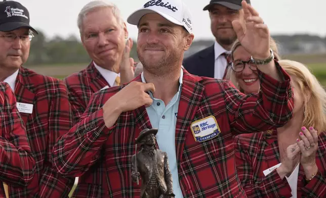 Justin Thomas celebrates after winning the RBC Heritage golf tournament, Sunday, April 20, 2025, in Hilton Head Island, S.C. (AP Photo/Mike Stewart)