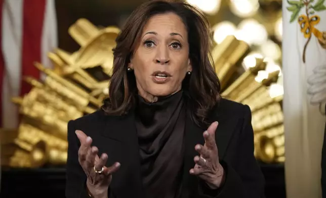 FILE - Vice President Kamala Harris speaks before signing the desk drawer in her ceremonial office, a long-standing tradition for Vice Presidents, in the Eisenhower Executive Office Building on the White House complex in Washington, Jan. 16, 2025. (AP Photo/Susan Walsh, File)