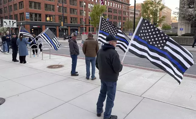 Christopher Schurr supporters stand outside the Kent County Courthouse in Grand Rapids, Mich., Monday, April 28, 2025. (Neil Blake/The Grand Rapids Press via AP)