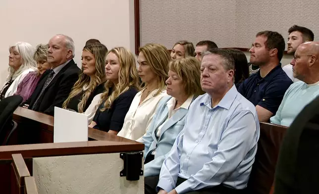 This image made from video provided by WOOD-TV shows Christopher Schurr's family members and supporters sitting in court at the Kent County Courthouse in Grand Rapids, Mich., on the first day of his trial, Monday, April 28, 2025. (WOOD-TV via AP, Pool)
