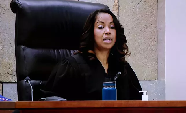 This image made from video provided by WOOD-TV shows Judge Christina Mims sitting in her courtroom at the Kent County Courthouse in Grand Rapids, Mich., on the first day of Christopher Schurr's trial, Monday, April 28, 2025. (WOOD-TV via AP, Pool)