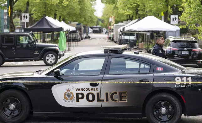 A Vancouver Police vehicle blocks the street leading the location where a vehicle drove into crowd, at a street festival on the night before, in Vancouver on Sunday April 27, 2025. (Rich Lam/The Canadian Press via AP)
