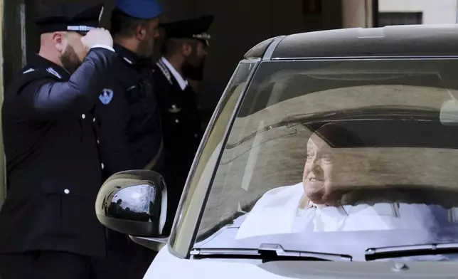 Pope Francis leaves in a car at the end of his visit on Holy Thursday to the Regina Coeli penitentiary in Rome, Thursday, April 17, 2025. (AP Photo/Andrew Medichini)