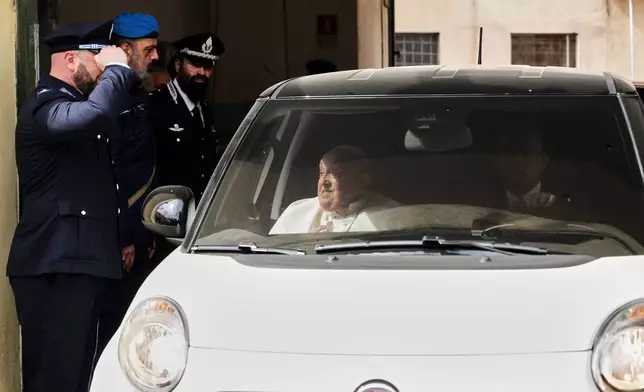 Pope Francis leaves in a car at the end of his visit on Holy Thursday to the Regina Coeli penitentiary in Rome, Thursday, April 17, 2025. (AP Photo/Andrew Medichini)