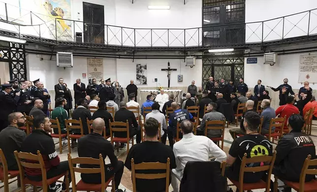 Pope Francis meets with inmates during his visit to the Regina Coeli penitentiary in Rome on Holy Thursday, Thursday, April 17, 2025. (Holy See Press Office via AP, HO)