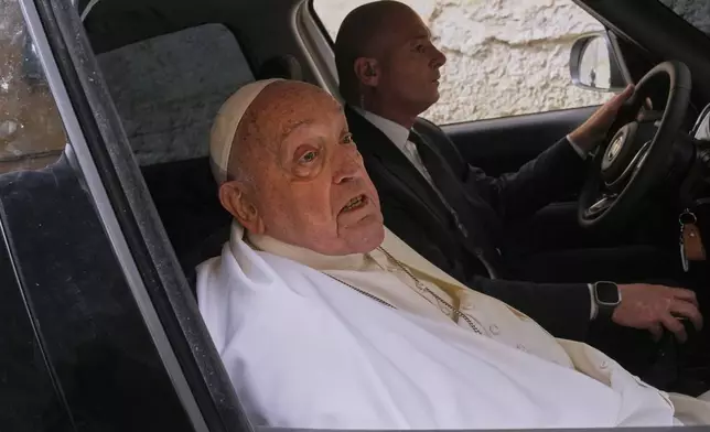 Pope Francis talks to journalists as he leaves at the end of his visit to the Regina Coeli penitentiary in Rome on Holy Thursday, Thursday, April 17, 2025. (AP Photo/Andrew Medichini)