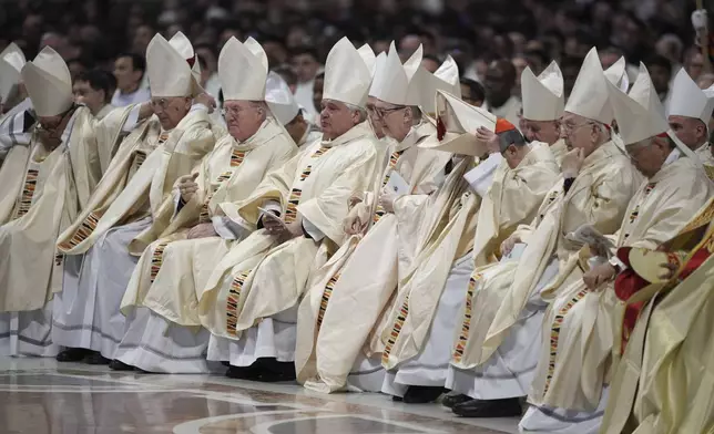 Cardinals attend the Chrism Mass presided over by Delegate of the Holy Father, Cardinal Domenico Calcagno, inside St. Peter's Basilica at The Vatican, Thursday, April 17, 2022. (AP Photo/Andrew Medichini)