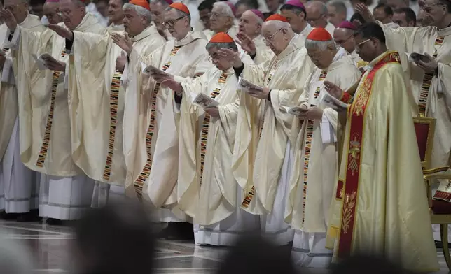Cardinals attend the Chrism Mass presided over by Delegate of the Holy Father, Cardinal Domenico Calcagno, inside St. Peter's Basilica at The Vatican, Thursday, April 17, 2022. (AP Photo/Andrew Medichini)