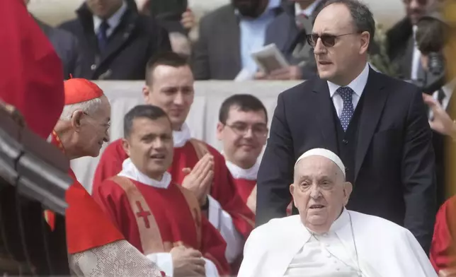 Pope Francis arrives at the end of the mass on Palm Sunday in St. Peter's Square at The Vatican, Sunday, April 13, 2025. (AP Photo/Gregorio Borgia)