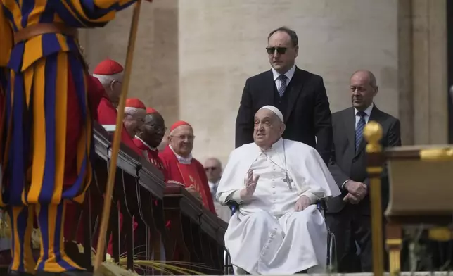 Pope Francis arrives at the end of the mass on Palm Sunday in St. Peter's Square at The Vatican, Sunday, April 13, 2025. (AP Photo/Gregorio Borgia)