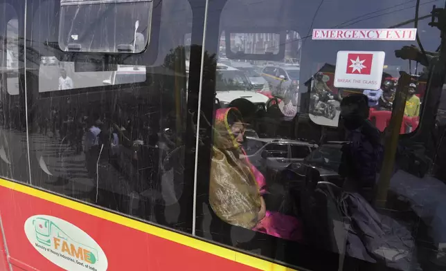 Relatives and friends of killed tourists move in a bus towards the airport in Srinagar, Indian controlled Kashmir, Wednesday, April 23, 2025. (AP Photo/Mukhtar Khan)