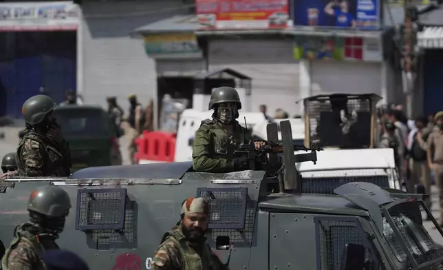 Indian soldiers guard in Srinagar, Indian controlled Kashmir, Wednesday, April. 23, 2025. (AP Photo/Mukhtar Khan)
