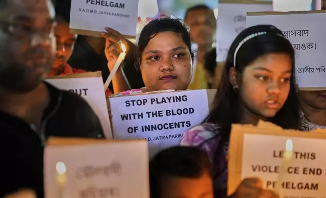 People protest against the killing of tourists by militants a day after militants indiscriminately opened fire on tourists near Pahalgam in Indian controlled Kashmir, in Guwahati, India, Wednesday, April 23, 2025. (AP Photo/Anupam Nath)