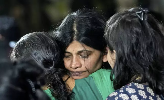 The wife of Sanjay Lele, who died in an attack on tourists in the Pahalgam region of Indian-administered Kashmir, reacts at Dombivali near Mumbai, India, Wednesday, April. 23, 2025.(AP Photo/Rajanish Kakade)