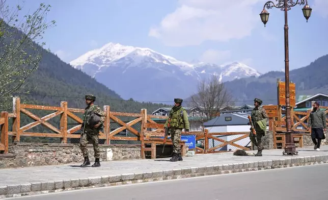 Security personnel patrol a street the morning after militants indiscriminately opened fire on tourists near Pahalgam in Indian controlled Kashmir, Wednesday, April 23, 2025. (AP Photo/Dar Yasin)