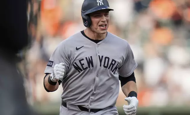 New York Yankees' Ben Rice reacts after hitting a home run during the first inning of a baseball game against the Baltimore Orioles, Tuesday, April 29, 2025, in Baltimore. (AP Photo/Stephanie Scarbrough)