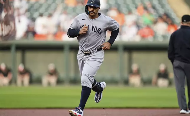 New York Yankees' Trent Grisham rounds the bases after hitting a home run during the first inning of a baseball game against the Baltimore Orioles, Tuesday, April 29, 2025, in Baltimore. (AP Photo/Stephanie Scarbrough)