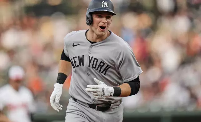 New York Yankees' Ben Rice reacts toward the dugout after hitting a home run during the second inning of a baseball game against the Baltimore Orioles, Tuesday, April 29, 2025, in Baltimore. (AP Photo/Stephanie Scarbrough)