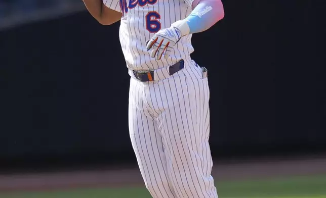 New York Mets' Starling Marte reacts after hitting a walk-off single during the tenth inning of a baseball game against the Philadelphia Phillies, Wednesday, April 23, 2025, in New York. (AP Photo/Seth Wenig)