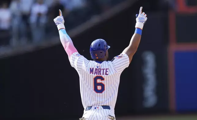 New York Mets' Starling Marte reacts after hitting a walk-off single during the tenth inning of a baseball game against the Philadelphia Phillies, Wednesday, April 23, 2025, in New York. (AP Photo/Seth Wenig)