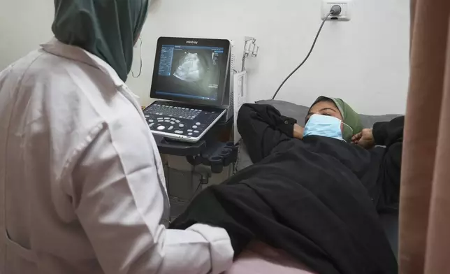 Pregnant Palestinian woman Yasmine Siam undergoes an ultrasound scan at Nasser Hospital in Khan Younis, in the southern Gaza Strip, Wednesday, April 9, 2025. She suffered a miscarriage a few days later. (AP Photo/Abdel Kareem Hana)
