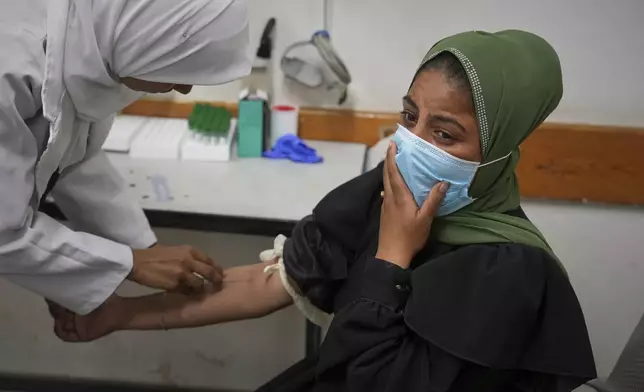 Palestinian woman Yasmine Siam, who was pregnant but suffered a miscarriage a few days later, undergoes a prenatal checkup at Nasser Hospital in Khan Younis, in the southern Gaza Strip, Wednesday, April 9, 2025. (AP Photo/Abdel Kareem Hana)