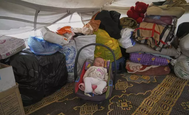 3-month-old, Jilan Zarrouk sleeps at a makeshift tent camp for displaced Palestinians in Muwasi, outskirts of Khan Younis in the southern Gaza Strip, Wednesday, April 9, 2025. (AP Photo/Abdel Kareem Hana)