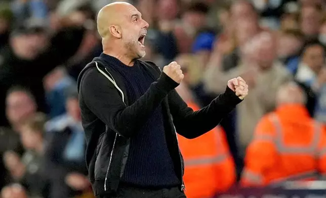 Manchester City manager Pep Guardiola celebrates their side's second goal of the game during a Premier League soccer match between Manchester City and Aston Villa, Tuesday, April 22, 2025, at the Etihad Stadium in Manchester, England. (Martin Rickett/PA via AP)