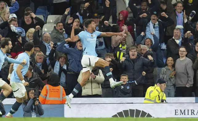 Manchester City's Matheus Nunes celebrates after scoring his side's second goal during the English Premier League soccer match between Manchester City and Aston Villa at Etihad stadium in Manchester, England, Tuesday, April 22, 2025. (AP Photo/Jon Super)